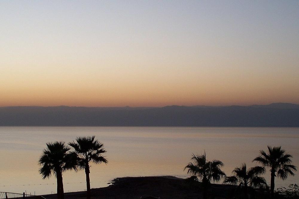 Salt crusts on the shore of the Dead Sea below the hills Salt crusts on the shore of the Dead Sea below the hills