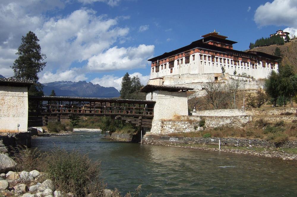 Rinpung Dzong above the Paro river with its covered bridge Rinpung Dzong above the Paro river with its covered bridge