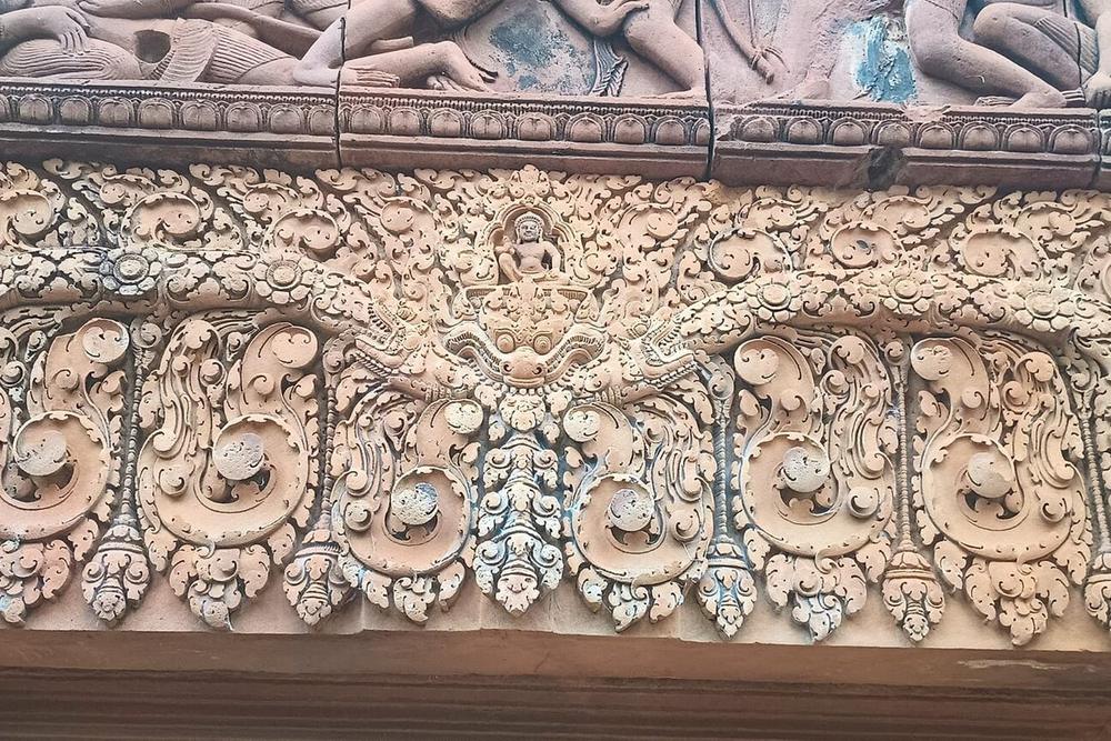Deep-cut pink sandstone carving at Banteay Srei Deep-cut pink sandstone carving at Banteay Srei