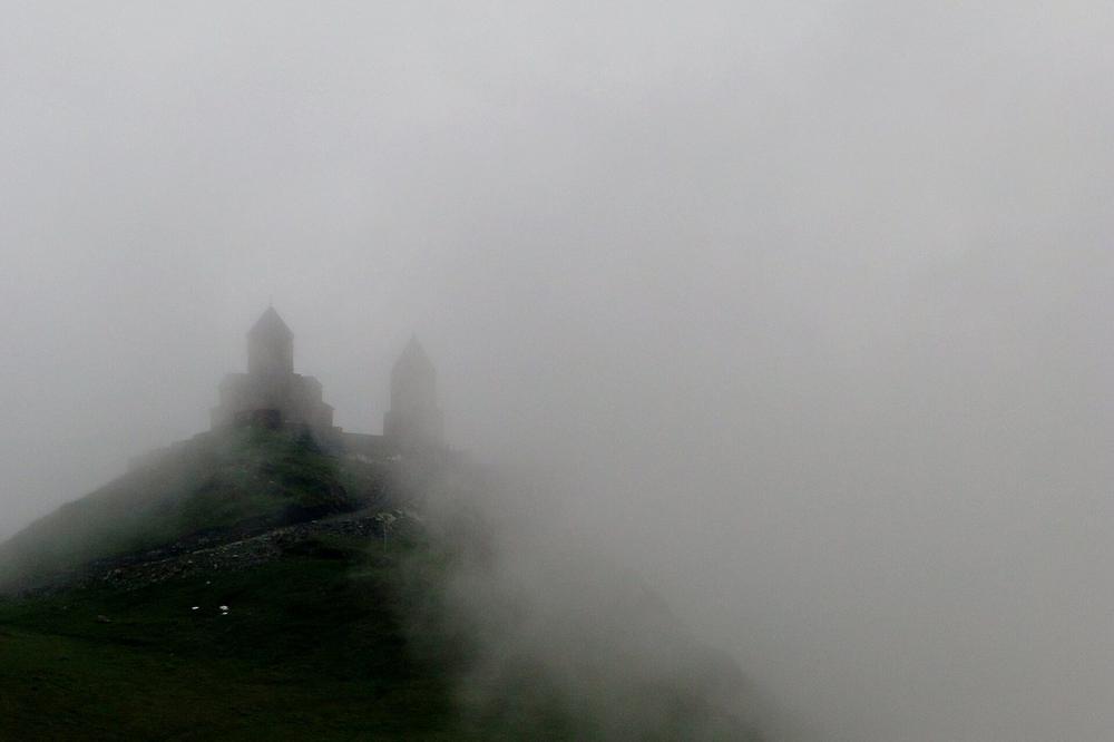 Gergeti Trinity church on its ridge above Stepantsminda Gergeti Trinity church on its ridge above Stepantsminda
