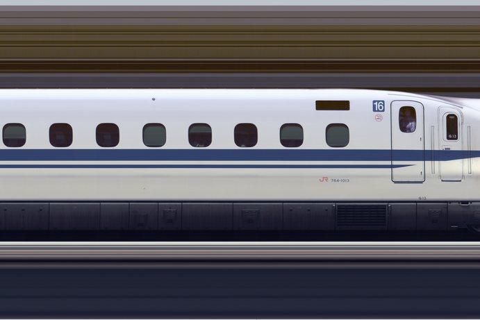 A high-speed train at a platform with its nose pointed down the track A high-speed train at a platform with its nose pointed down the track