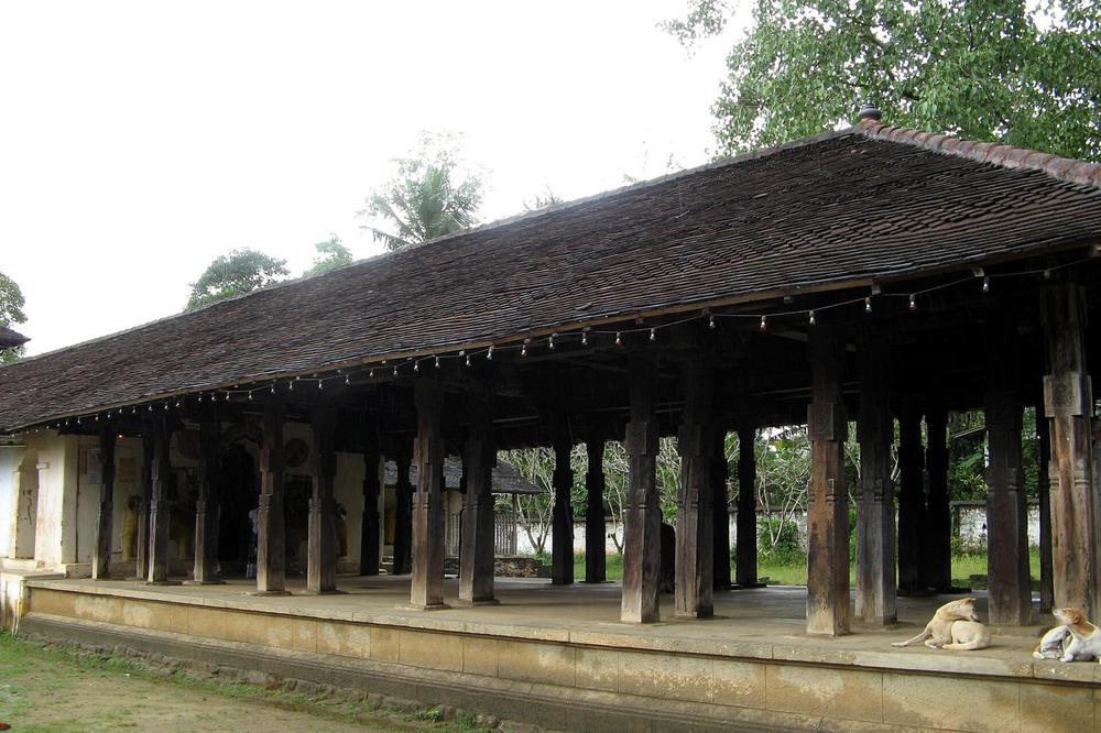 Carved wooden pillars in the hall at Embekke near Kandy Carved wooden pillars in the hall at Embekke near Kandy