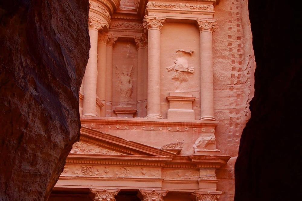 The Treasury facade seen through the narrow opening at the end of the Siq The Treasury facade seen through the narrow opening at the end of the Siq