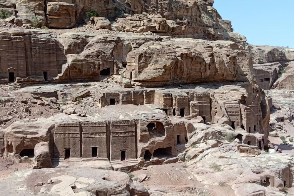 Royal tomb facades cut high into the cliff above the main valley Royal tomb facades cut high into the cliff above the main valley