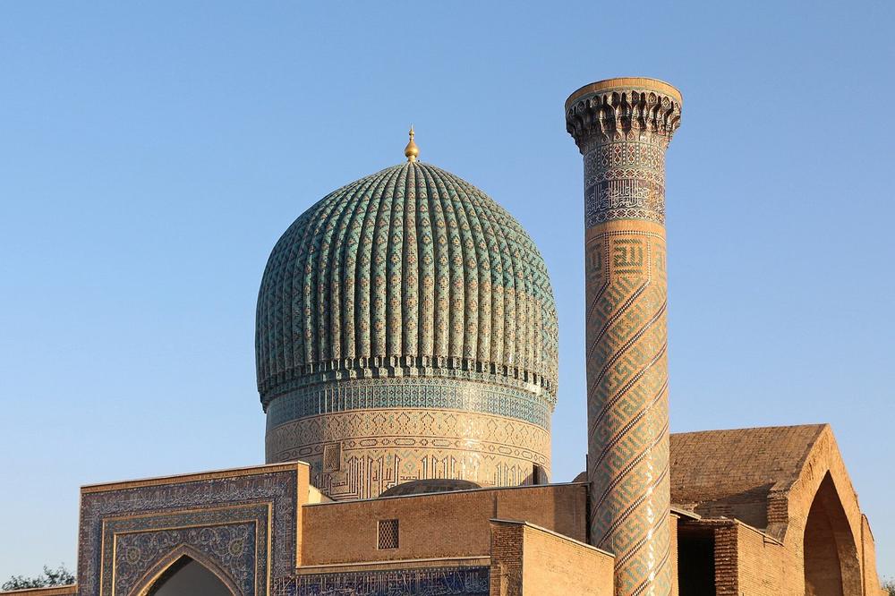 The ribbed and fluted dome of Gur-e-Amir against a clear sky The ribbed and fluted dome of Gur-e-Amir against a clear sky
