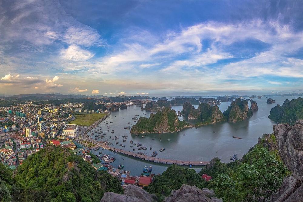Limestone islands standing in flat water off the Cat Ba coast Limestone islands standing in flat water off the Cat Ba coast